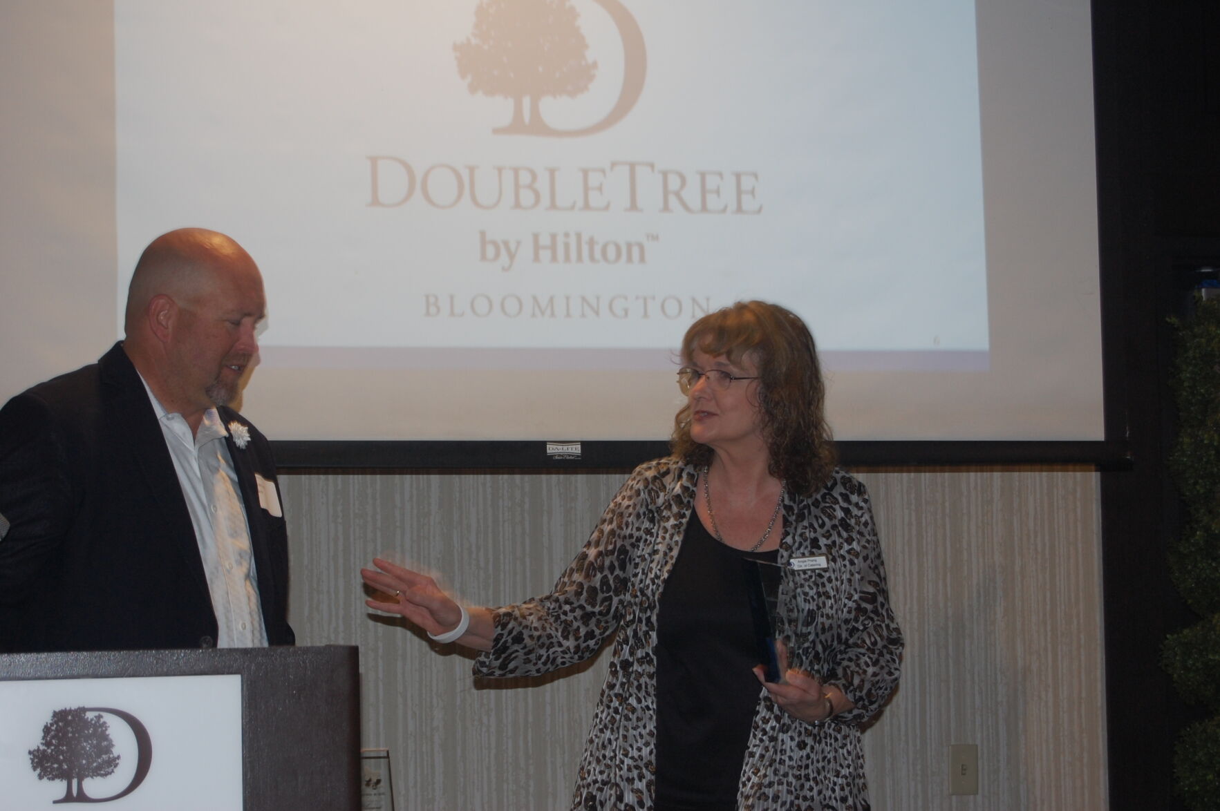 Chris McConnell presents Angie Prang of DoubleTree by Hilton with Corporate Partner Award